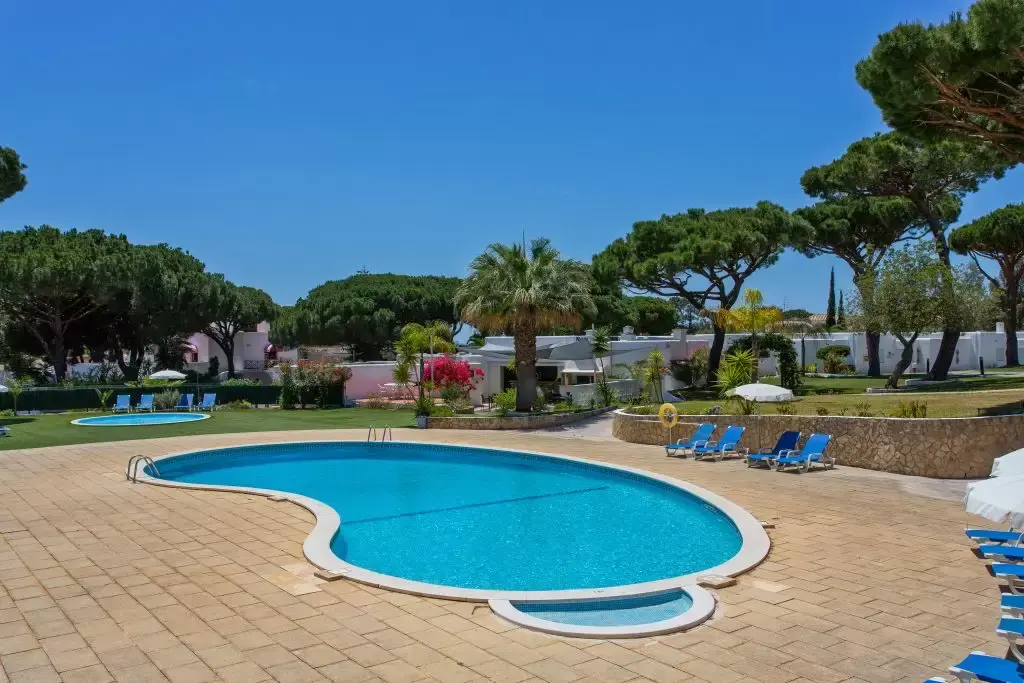 Algarve Villa Holidays - Large pool surrounded by blue sunbeds